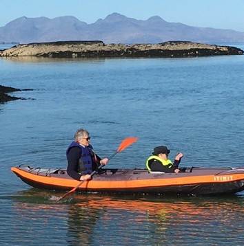 Darren and Moira in a canoe on water